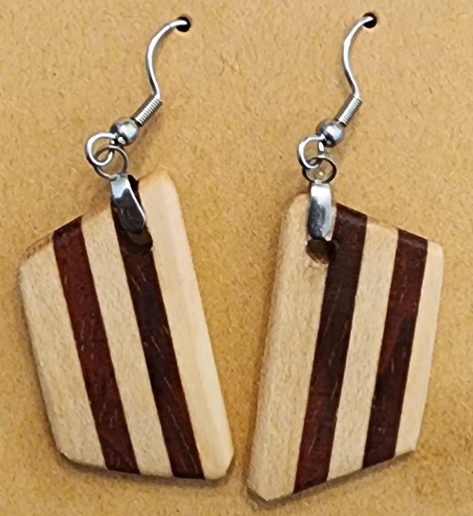 Maple Verge wooden earrings with striped dark and light wood tones. Handcrafted and lightweight for everyday wear.

Black ribbon gift box for wooden earrings, available as a $3 add-on. Perfect for birthdays, weddings, and special occasions.