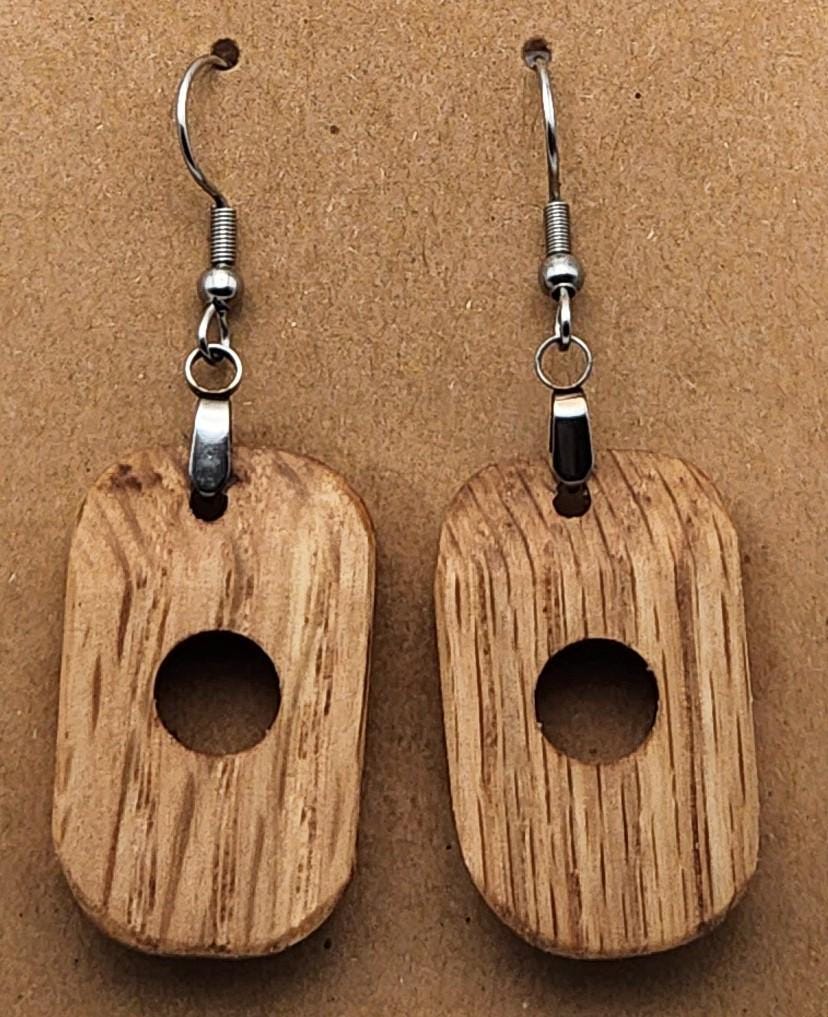 Oak Hollow circular earrings in rich dark wood. Smooth finish and handcrafted for a bold, natural look.

Black ribbon gift box for wooden earrings, available as a $3 add-on. Perfect for birthdays, weddings, and special occasions.