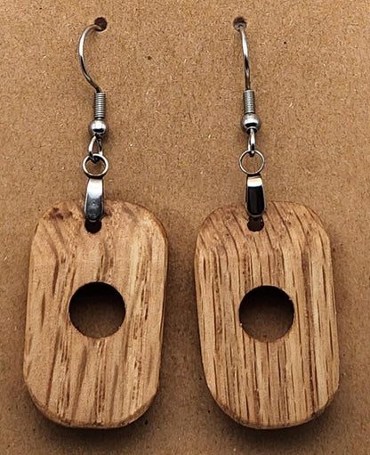 Oak Hollow circular earrings in rich dark wood. Smooth finish and handcrafted for a bold, natural look.

Black ribbon gift box for wooden earrings, available as a $3 add-on. Perfect for birthdays, weddings, and special occasions.