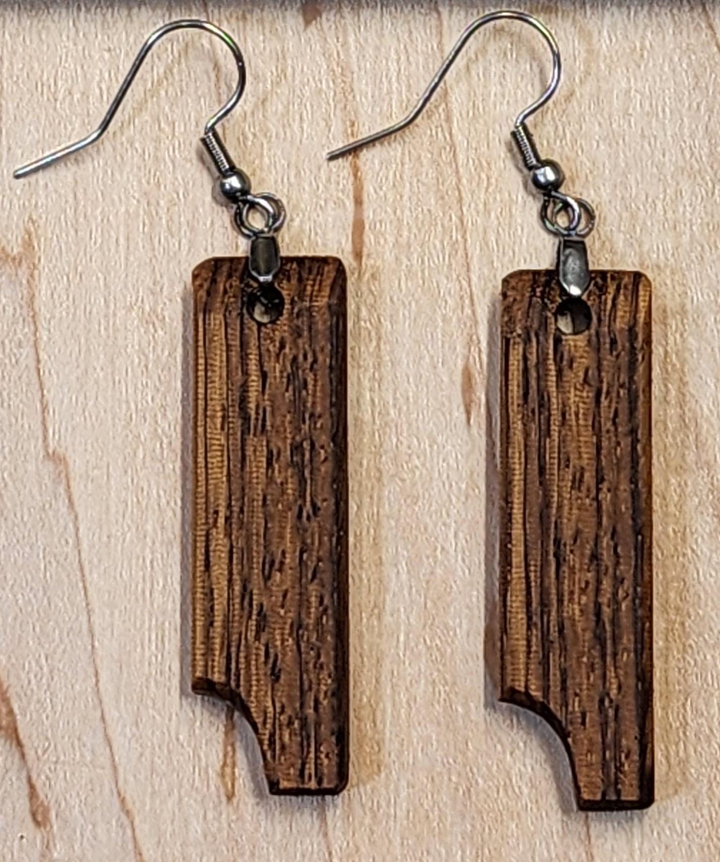 Grainmark Drop vertical rectangular earrings with mixed wood tones. Handcrafted with natural contrast and texture.

Black ribbon gift box for wooden earrings, available as a $3 add-on. Perfect for birthdays, weddings, and special occasions.