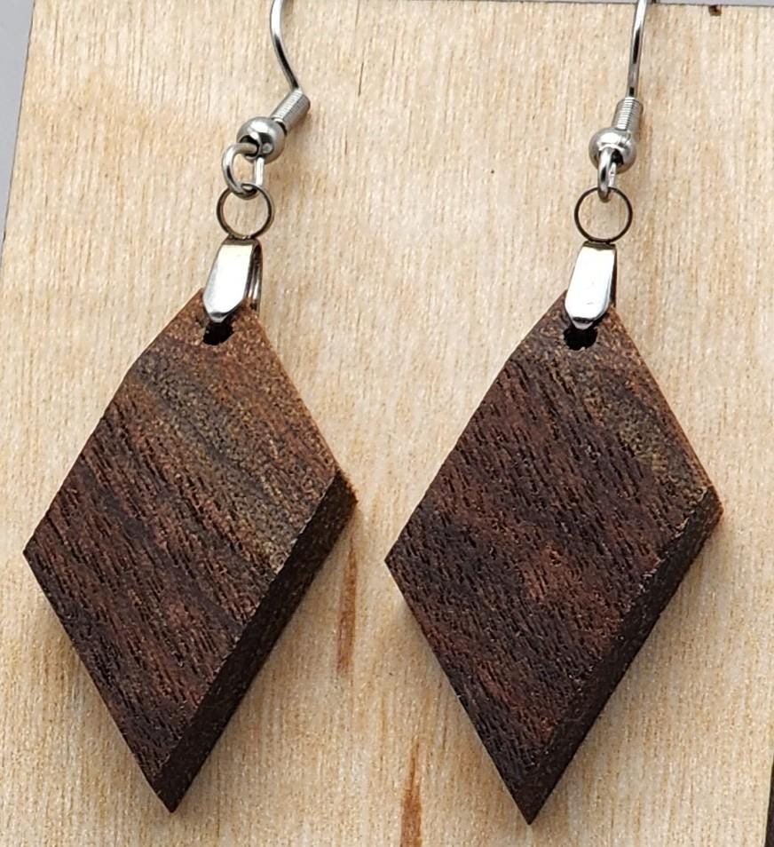 Darkgrain Kite diamond-shaped earrings in deep wood grain. Lightweight and handcrafted for a geometric style.

Black ribbon gift box for wooden earrings, available as a $3 add-on. Perfect for birthdays, weddings, and special occasions.